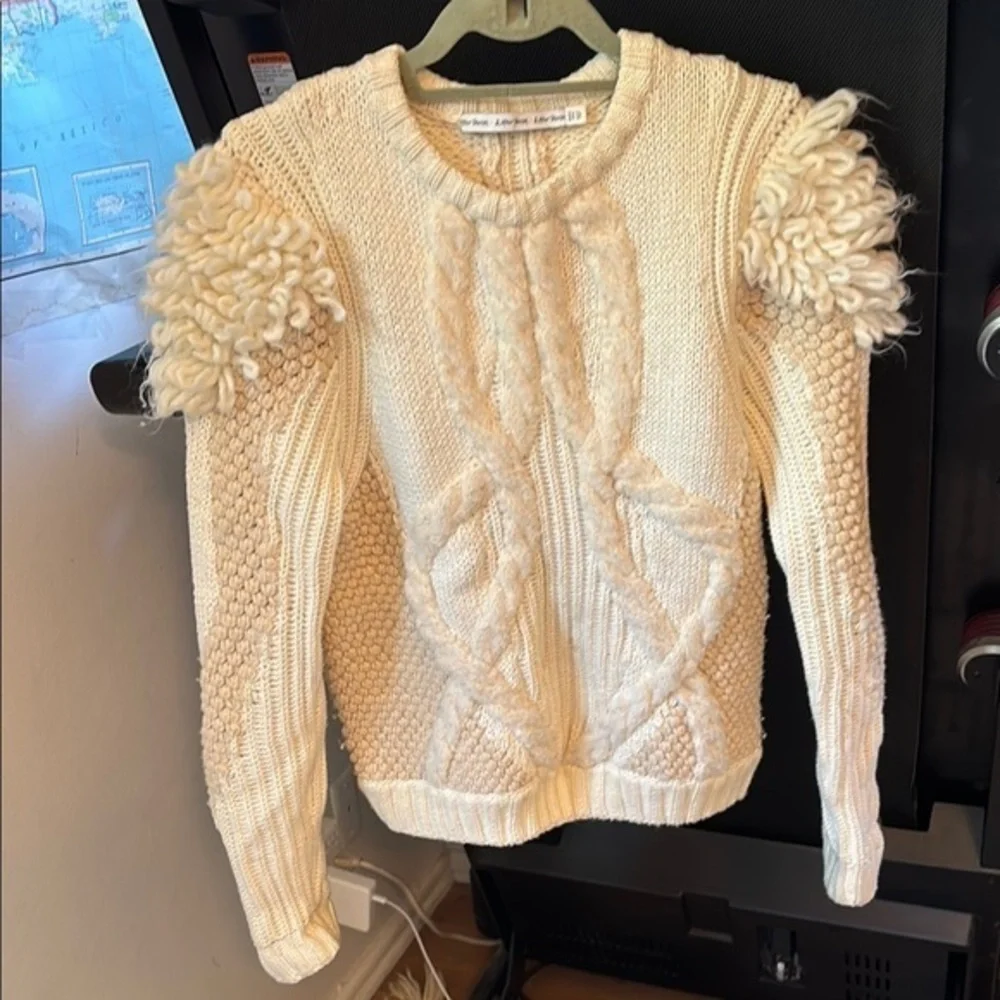 Elegant Cream Sweater with Textured Sleeves
